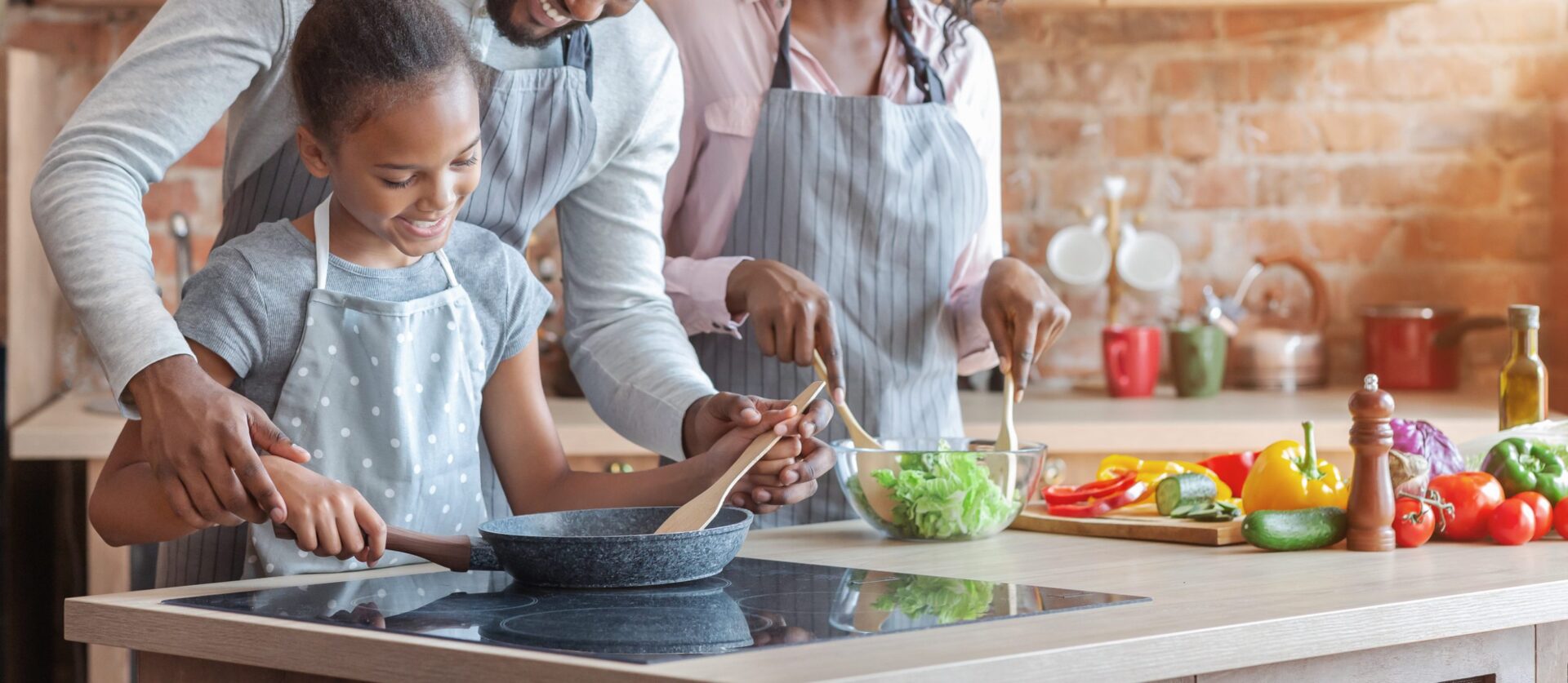 Cute african girl learning how to cook healthy meal