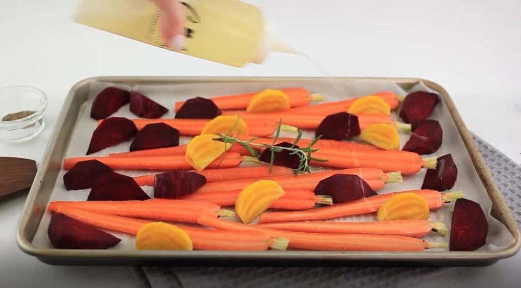Roasted carrots and beets in a baking dish